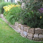 Garten- und Landschaftsbau Peter Oskar in Reithofen - Garten Blumen Rasen Blüten Pracht Mauer Stein